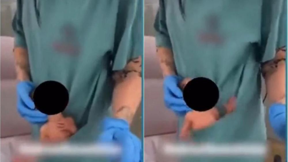 Fisioterapeuta é afastada após fazer dancinha com recém-nascido no bolso de jaleco